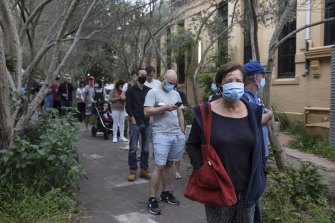 Voters wait in line to cast their votes at Erskineville Public School on Saturday.