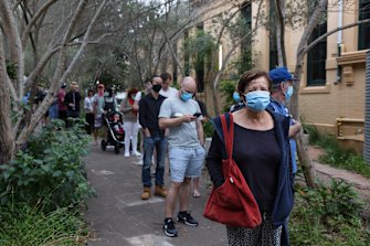 Voters wait in line to cast their votes at Erskineville Public School on Saturday.