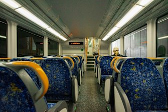 A lone passenger travels on a train in the CBD in April. 