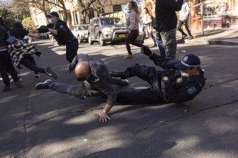Anti-lockdown protesters clash with police in Sydney. 