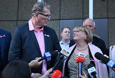 Lynette Dawson’s brother Greg Simms and his wife Merilyn Simms speak to a media scrum after the verdict.
