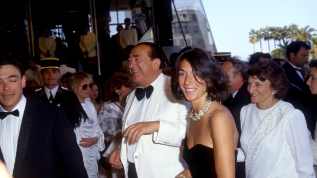 Ghislaine Maxwell, in a black dress, pictured with her father, British media tycoon and fraudster Robert Maxwell.
