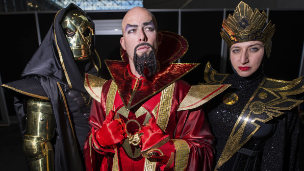 Who can save them now? Fans dressed as Klytus, Ming and Kala from Flash Gordon.