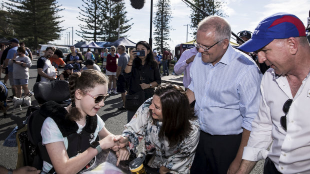 Prime Minister Scott Morrison, his wife Jenny and Petrie MP Luke Howarth meet Sophie during a street walk.