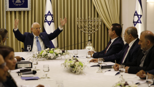 Israeli President Reuven Rivlin, left, speaks with members of the Joint List Ayman Odeh, third right, and Ahmad Tibi, second right, and Mansour Abbas in Jerusalem.