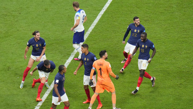 France celebrate Harry Kane’s missed spot kick.