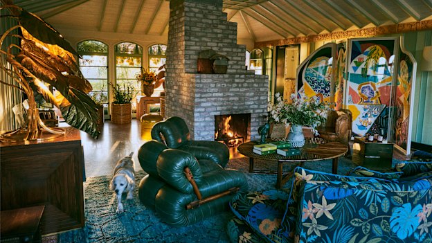 The living room at Flamingo Estate, featuring a David Hockney four-panel 
screen to the right. 