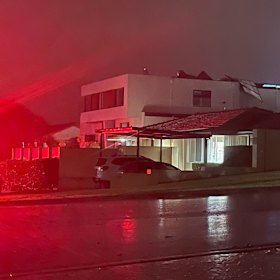 A home in City Beach, along Kalari Drive, where the roof has been severely damaged.