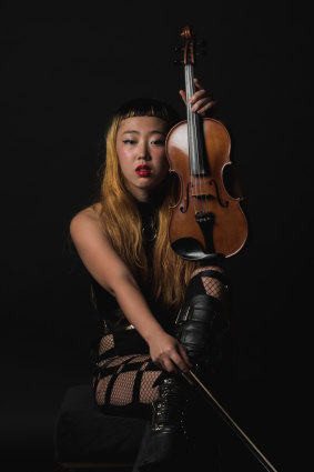 Elle Shimada, violinist, performs the work of Mary Kiernan in <i>The Unforgetting of Mary K</i>.