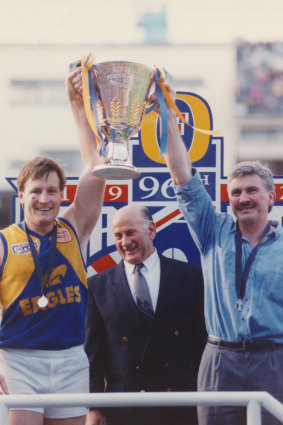 Eagles skipper John Worsfold, president Charlie Sutton and coach Mick Malthouse hold their prize aloft.