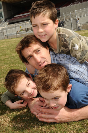Scott West in 2008 with three of his sons: Rhylee (top, then eight), and Cooper and Kobi (then five).
