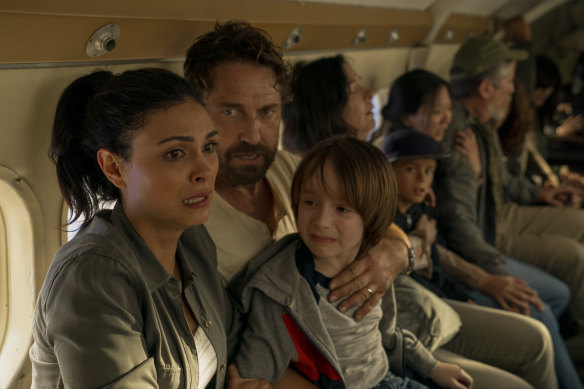 Morena Baccarin, Gerard Butler and Roger Dale Floyd in a scene from the Amazon Prime film Greenland.