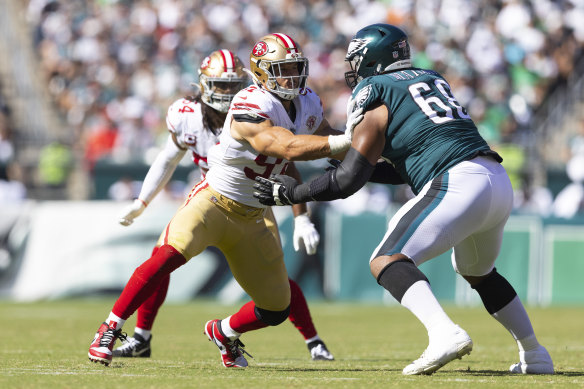 Eagles offensive lineman Jordan Mailata and 49er pass rusher Nick Bosa.