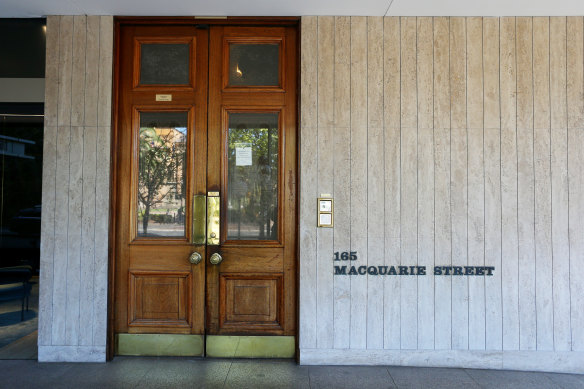 The Australian Club’s simple wooden doors look like the entry to an office rather than an elite and luxurious club. It’s almost as if the club is pretending not to be there. 