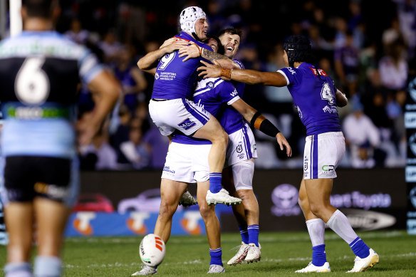 Reed Mahoney and Jack Todd of the Bulldogs celebrate at full-time. 