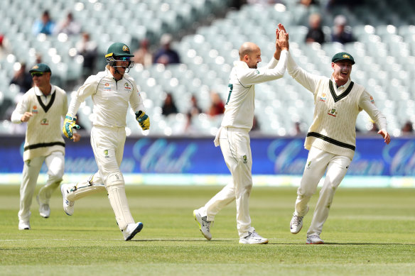 Hands up: Nathan Lyon runs riot on day four of the second Test with Pakistan. 