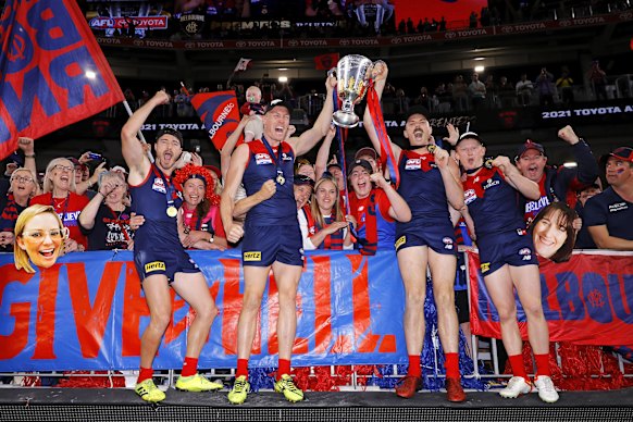 Tom McDonald celebrates the 2021 premiership with teammates. 