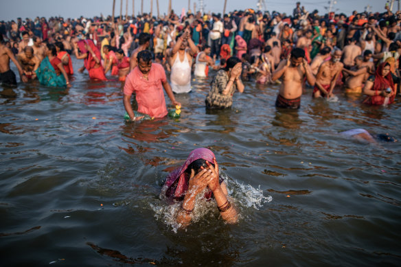 Bathing at the confluence of the sacred rivers is said to free devotees from the cycle of life and death.