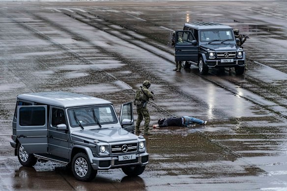 Officers perform a drill during an open house at the Hong Kong Police College in Hong Kong during National Security Education Day.