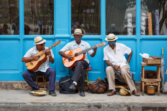 Musicians play in the postcard-perfect Old Havana city centre.