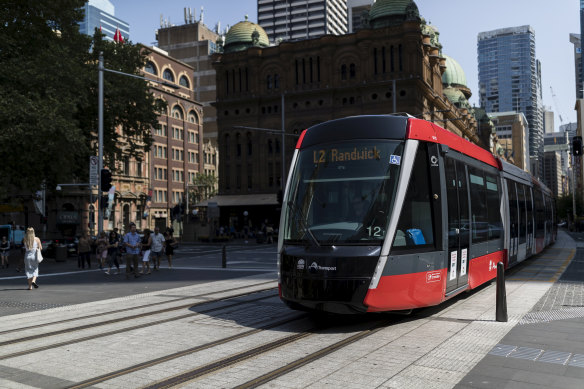 A tram moves down George Street on Monday.