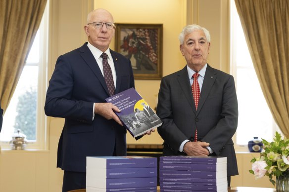 Governor-General David Hurley receives the final royal commission report from its chair Ronald Sackville.