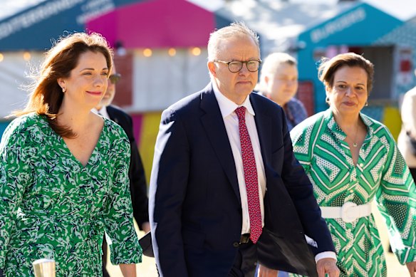 Ministers Anika Wells and Michelle Rowland with Prime Minister Anthony Albanese in 2023.