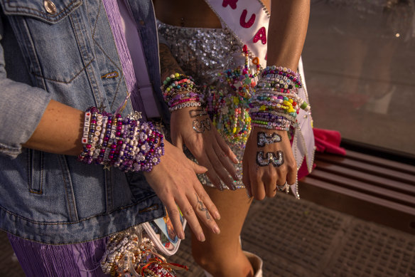 Taylor Swift fans in Argentina show off their bracelets.
