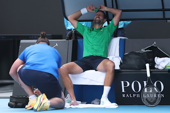 Novak Djokovic receives medical treatment for a blister.