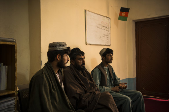 Left to right: Shamsullah, Fazal Rahman and Sharifullah, whose families were alleged victims of separate incidents involving Australian soldiers, are interviewed by Dad Mohammad Hamidzai (out of frame) inside the Uruzgan office of the Afghan Independent Human Rights Commission (AIHRC) in Tarin Kowt.
