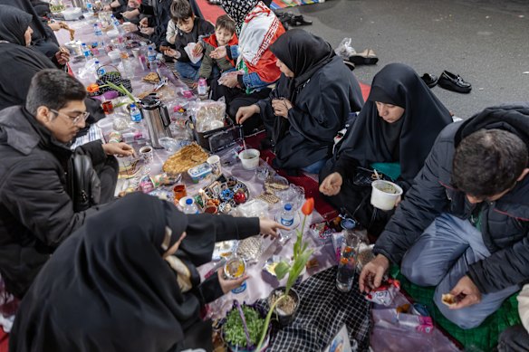 Iranians gather for Iftar in Tehran, as the end of Ramadan coincides with the Persian New Year on Friday.