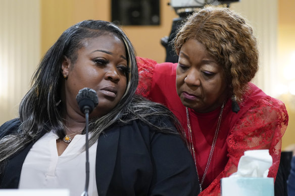 Wandrea “Shaye” Moss, a former Georgia election worker, is comforted by her mother Ruby Freeman, right, while giving evidence.