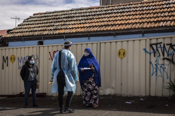 People wait for COVID-19 tests at a walk-in clinic in Lakemba on 28 August, 2021.