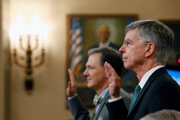 Top US diplomat in Ukraine William Taylor, right, and career Foreign Service officer George Kent, left are sworn in to testify at the first public impeachment hearings into President Donald Trump. 