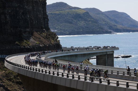 The peloton rounds the Sea Cliff Bridge during the men’s road race.