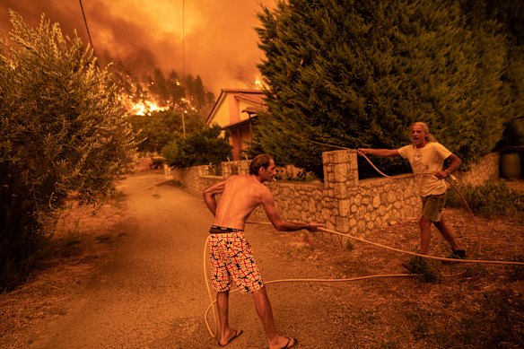 Greece wildfire sweeps island as anger mounts over firefighting response