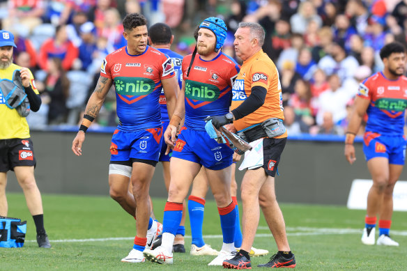 Jackson Hastings trudges off the McDonald Jones Stadium turf on Sunday.