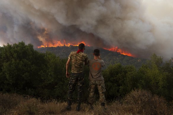 A forest fire near the village of Sykorrahi, Greece. Recent wildfires in the country have killed 20 people.