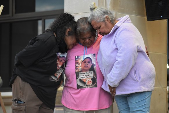 Tiffany Woodley’s family break down at a candlelit vigil in her memory last week.