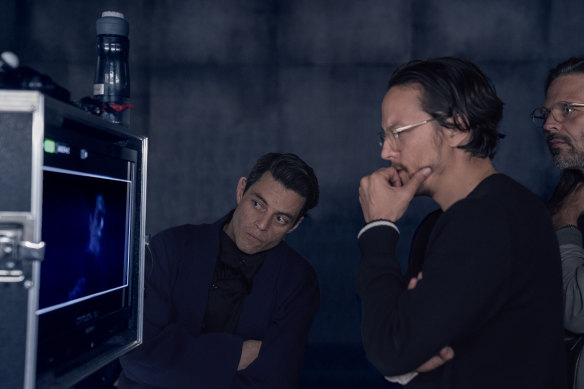 Rami Malek (left) and Cary Joji Fukunaga on the set of No Time to Die. 