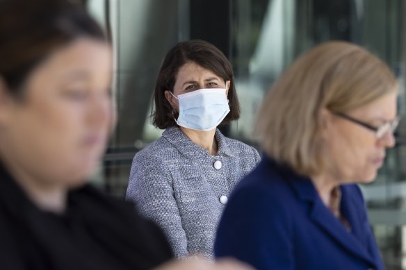 Premier Gladys Berejiklian watches CHO Kerry Chant give a COVID-19 update on Saturday.