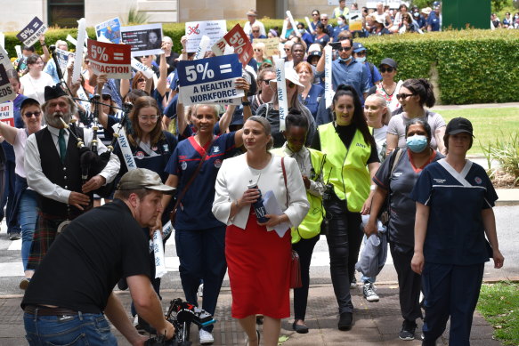 ANF secretary Janet Reah walks with protesters during a 2022 rally.