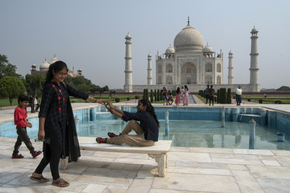 Families at the Taj Mahal in Agra, India, in June. Rather than the typical global mix of travelers, it is now visited mostly by local residents. 