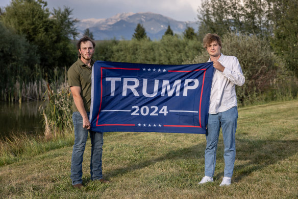 Louis Wagner-Lang, left, and Van Ricker, seniors at Montana State University, with a Trump flag in a park in Bozeman, Montana, this month.