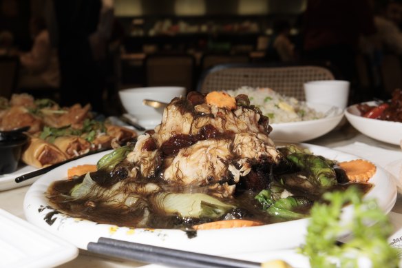 Pork knuckle with black moss at Jumbo Seafood in Mount Pritchard. 