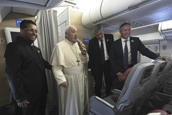 Pope Francis talks to reporters during the return flight from Ulaanbaatar, Mongolia.