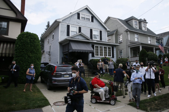 Supporters and media gather outside the childhood home of Democratic presidential candidate Joe Biden during a visit by the former vice-president in July.
