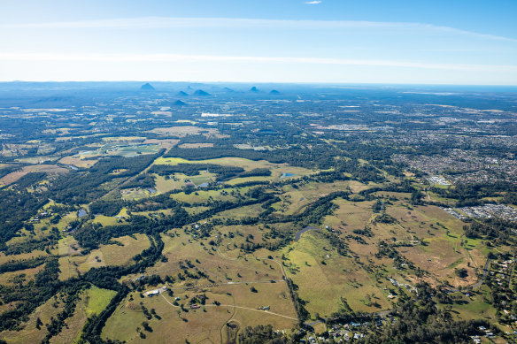 Southeast Queensland’s newest suburb, Lilywood, will be built west of Caboolture, with the Glasshouse Mountains in the distance.