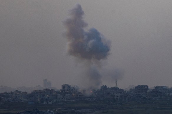 Smoke rise over ruined building in the Gaza Strip after an Israeli bombardment as seen from a position on the Israeli side of the border on April 2.