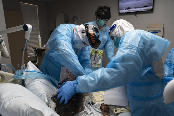 Medical staff treat a COVID-19 patient in the intensive care unit of a hospital in Houston, Texas last month.